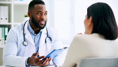 Doctor consulting with a male patient in a private clinic setting. Doctor consulting with a male patient in a private clinic setting.